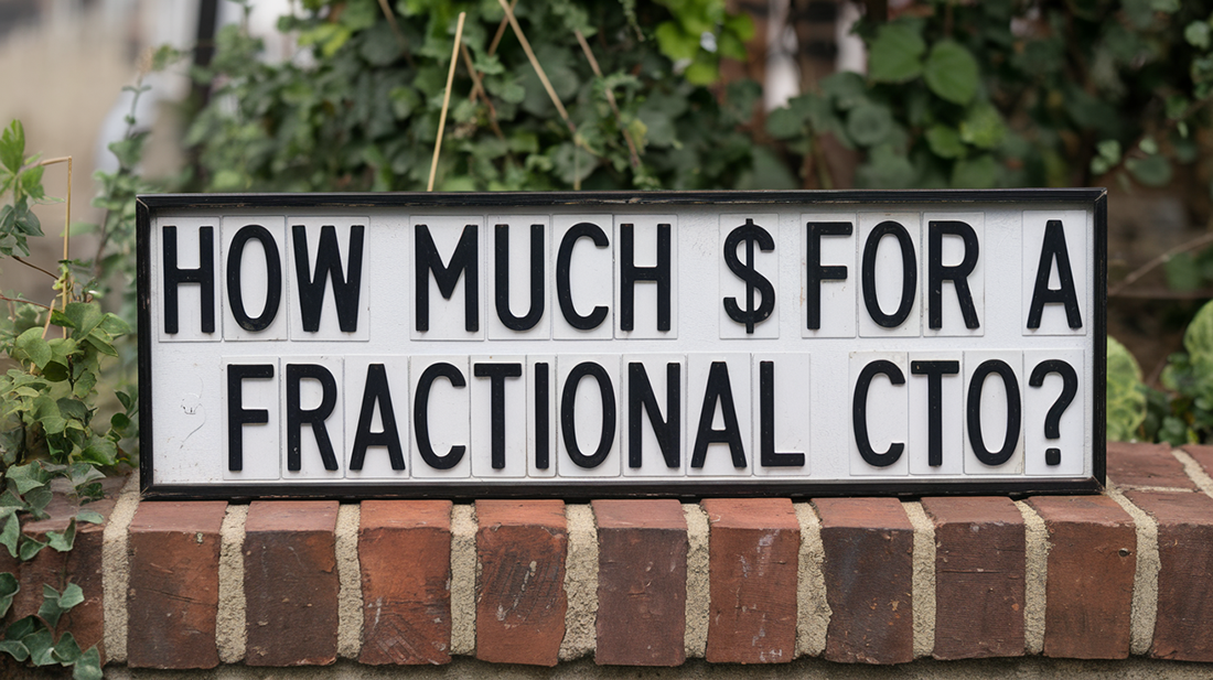 Sign on a brick wall with the text 'How much $ for a Fractional CTO?' displayed in bold black letters, sparking the question of how much to pay for a Fractional CTO.